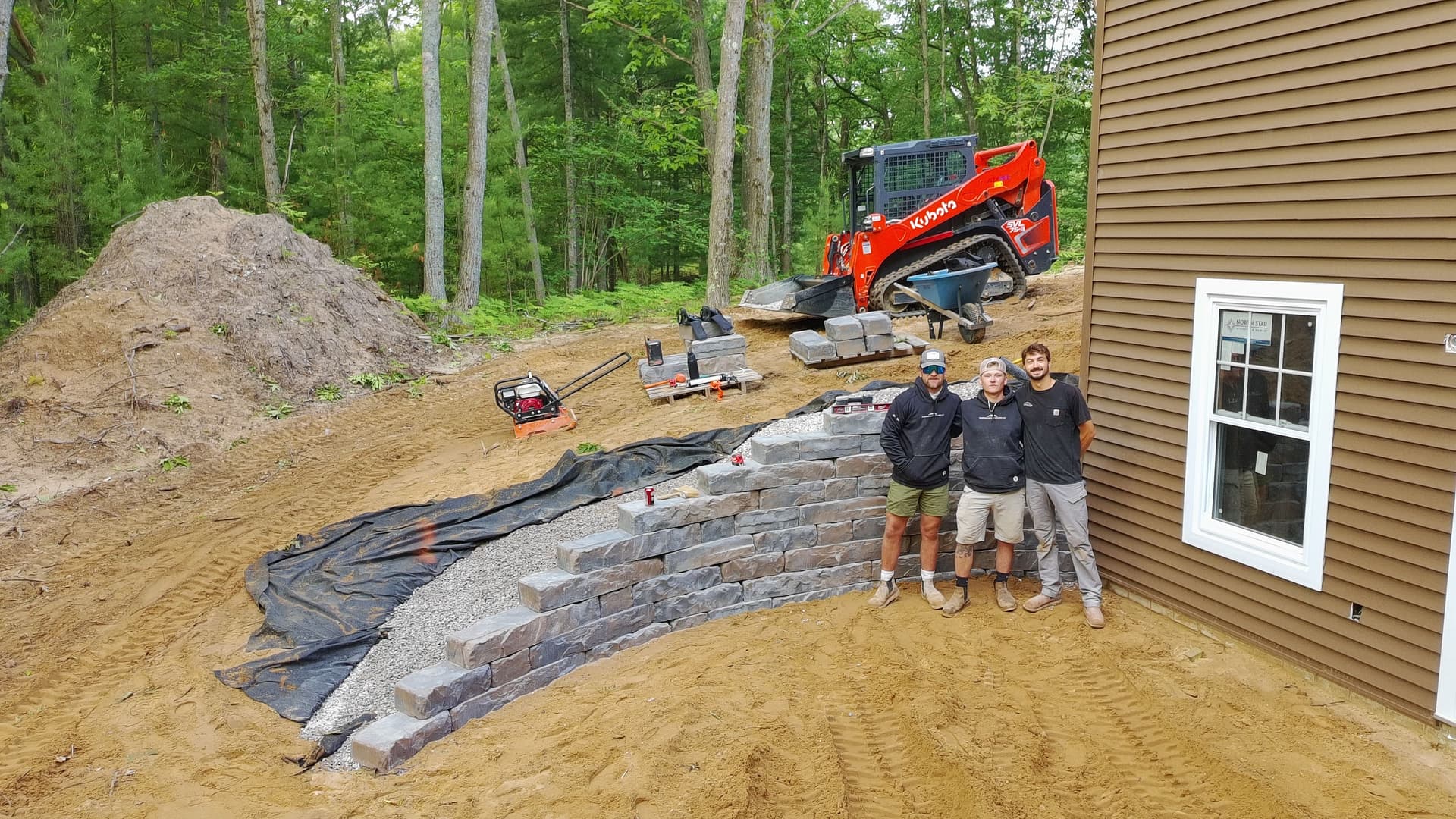 Basement Walkout Retaining Wall Built to Match the Land image