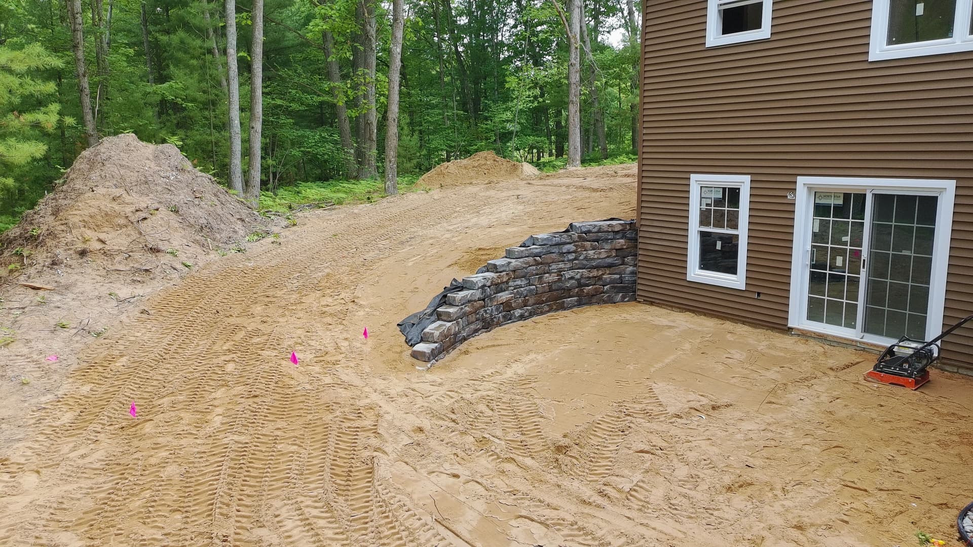 Gallery photos for Basement Walkout Retaining Wall Built to Match the Land: Image #2